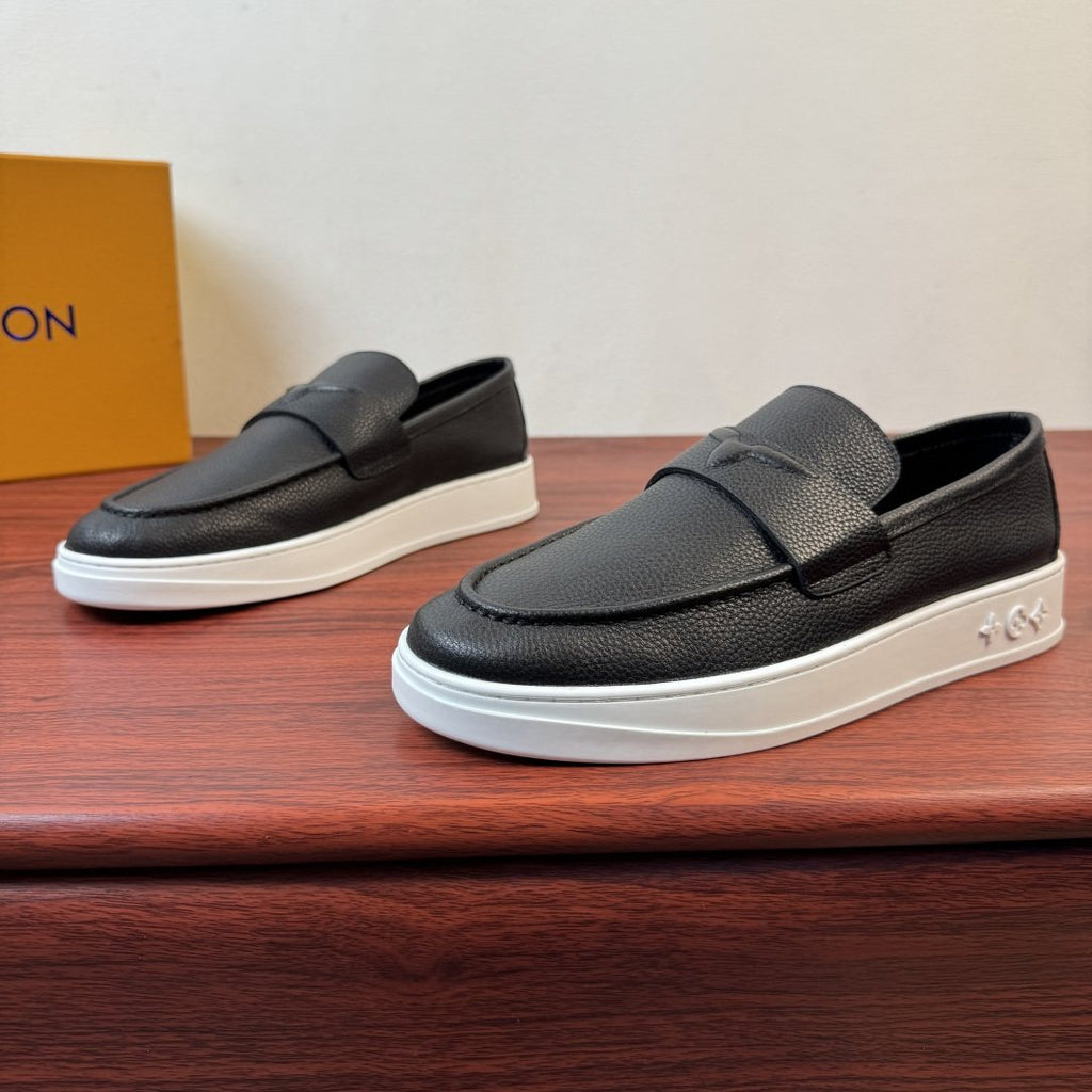 Louis Vuitton Textured Slip-On Loafers — front